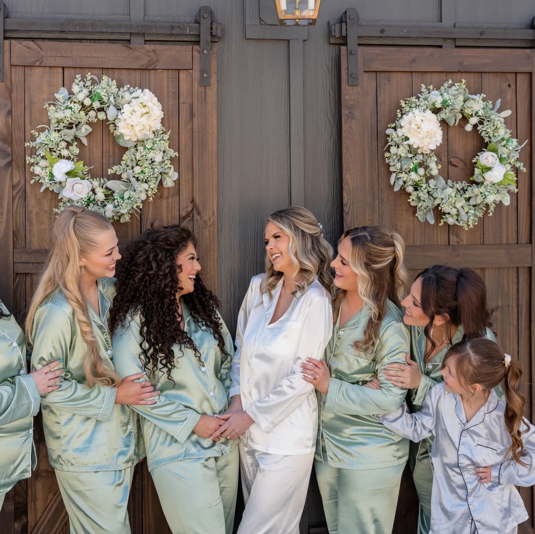 Chateau Amelia - Bride and bridesmaids in front of events barn at Greenville SC wedding venues with lodging