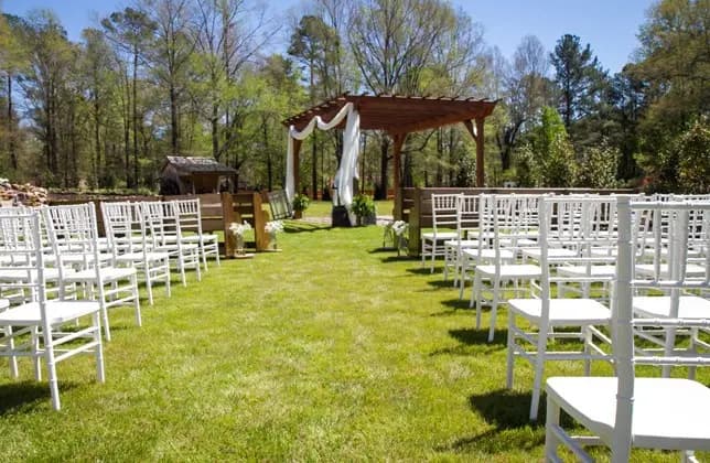 M Garden chairs set up on pond bank for outdoor ceremony Columbia SC