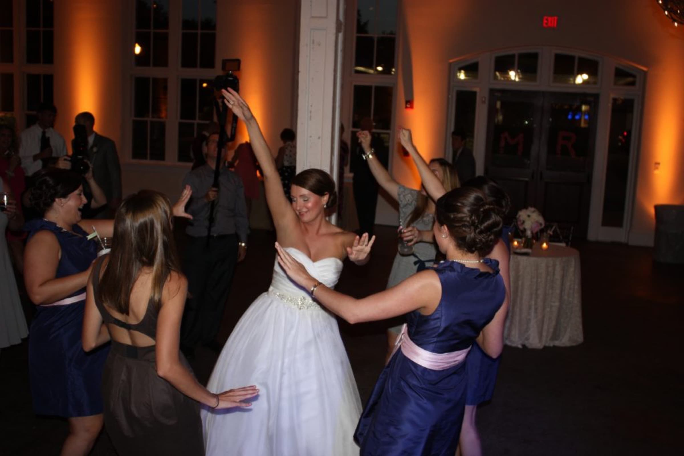 Party Carolina DJs - bride dancing with guests at a ballroom reception